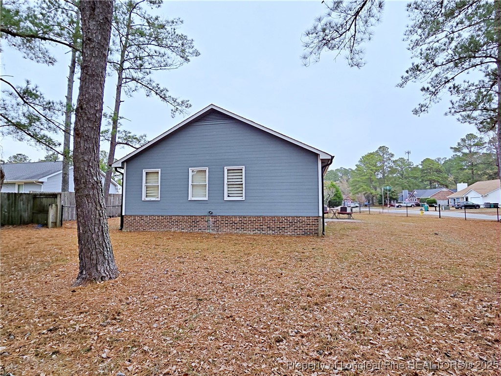 5309 Tory Hill Road Hope Mills, NC 28348 - Photo 43 of 45 a house with trees in front of it