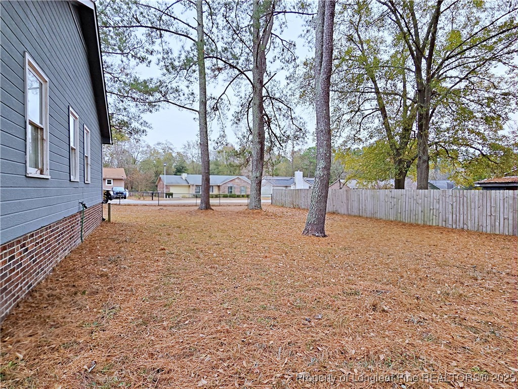 5309 Tory Hill Road Hope Mills, NC 28348 - Photo 44 of 45 a view of a yard with plants and trees