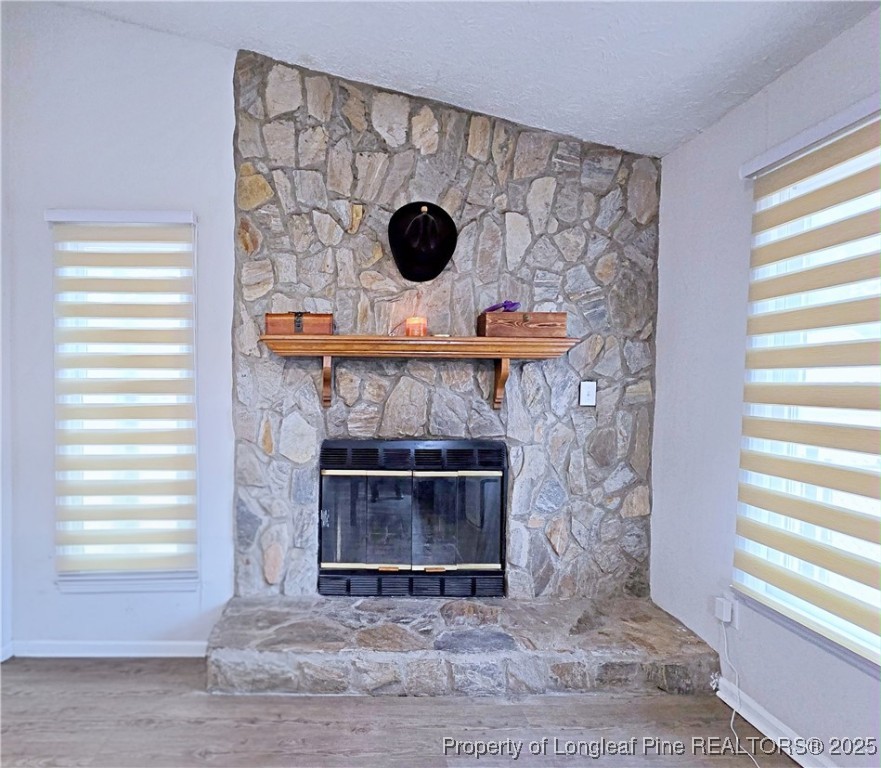 5309 Tory Hill Road Hope Mills, NC 28348 - Photo 7 of 45 a living room with a fireplace and a window