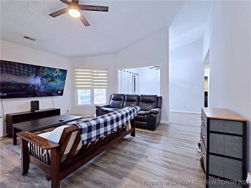 5309 Tory Hill Road Hope Mills, NC 28348 - Photo 9 of 45 a living room with furniture and a flat screen tv