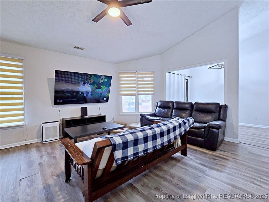 5309 Tory Hill Road Hope Mills, NC 28348 - Photo 10 of 45 a living room with furniture and a flat screen tv