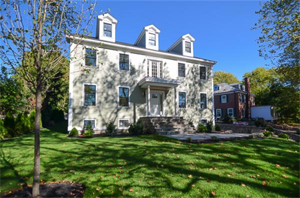 18 Penniman Road Brookline, MA 02445 - Photo 1 of 18 a front view of a house with a yard
