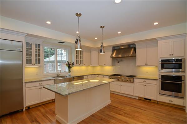 18 Penniman Road Brookline, MA 02445 - Photo 7 of 18 a kitchen with stainless steel appliances granite countertop a sink stove and refrigerator