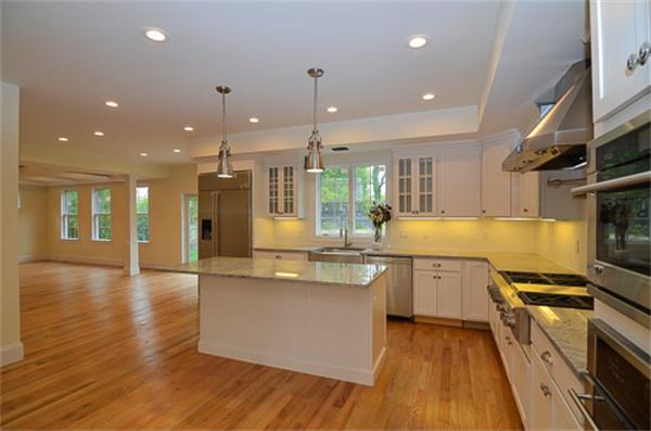 18 Penniman Road Brookline, MA 02445 - Photo 10 of 18 a large kitchen with stainless steel appliances kitchen island granite countertop a large stove a sink and a refrigerator