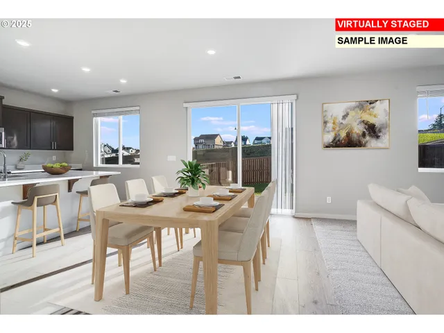 a view of a dining room with furniture window and outside view