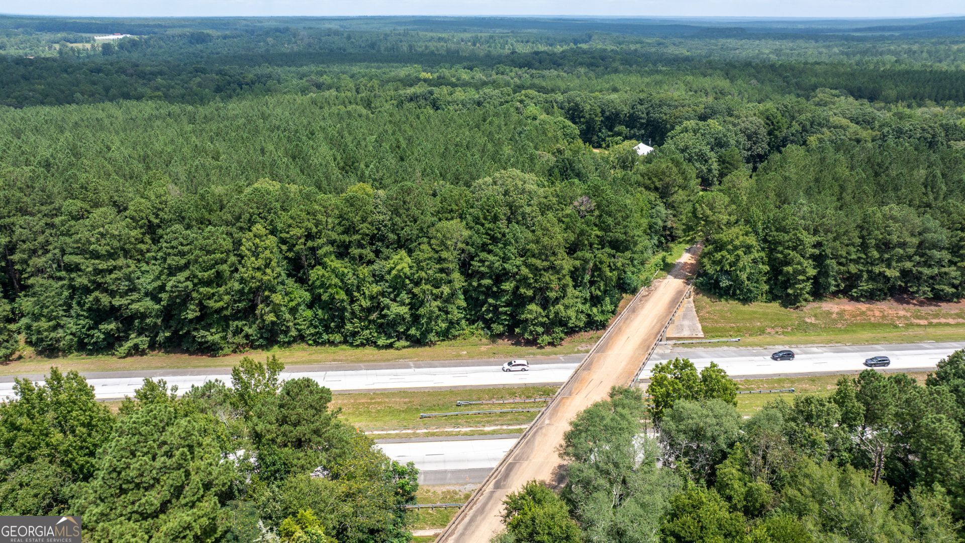 0 Frank Smith Road Norwood, GA 30821 - Photo 4 of 17 a view of a yard with an outdoor seating and a lots of trees
