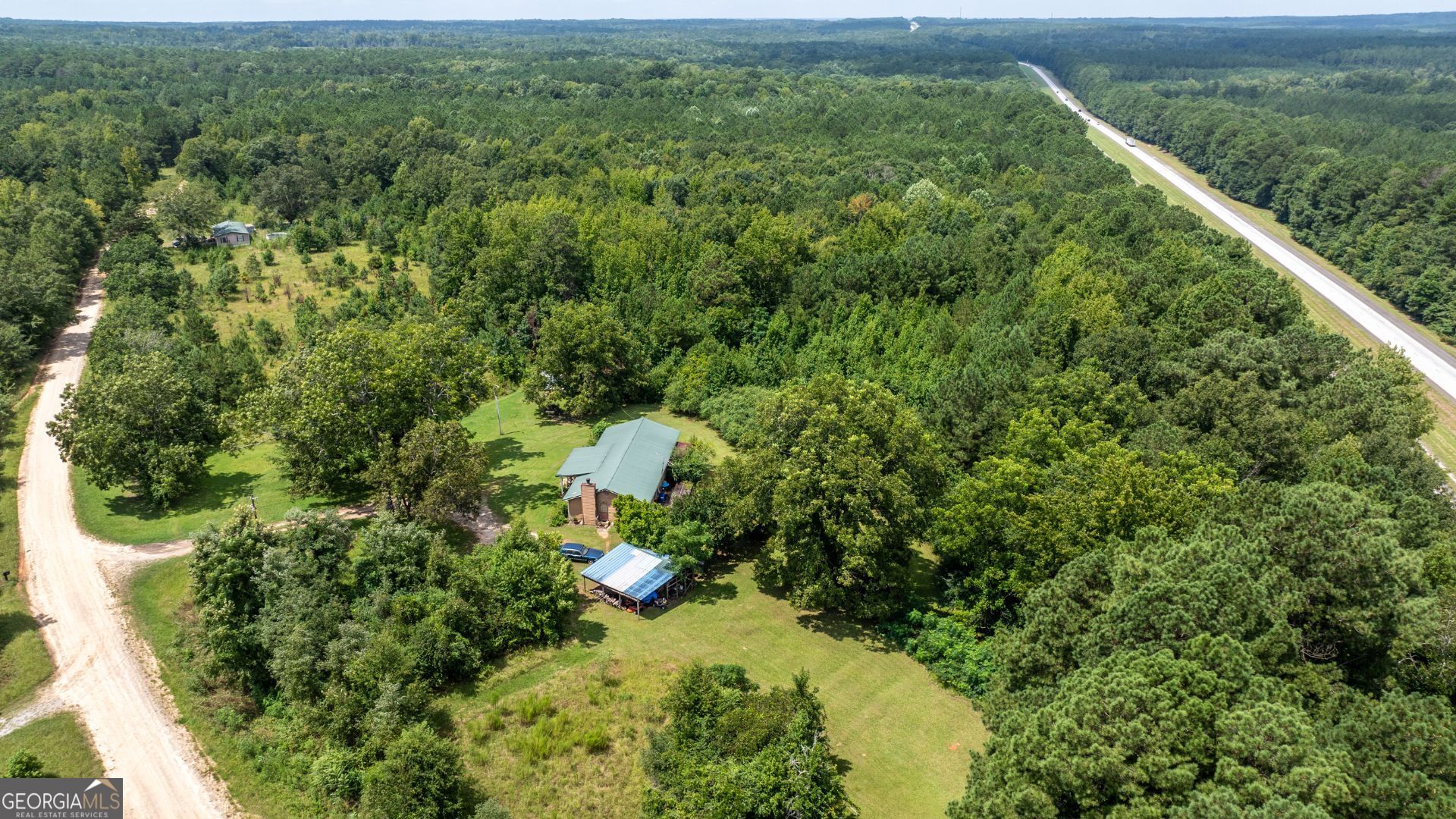 0 Frank Smith Road Norwood, GA 30821 - Photo 6 of 17 a view of a yard with plants and large trees