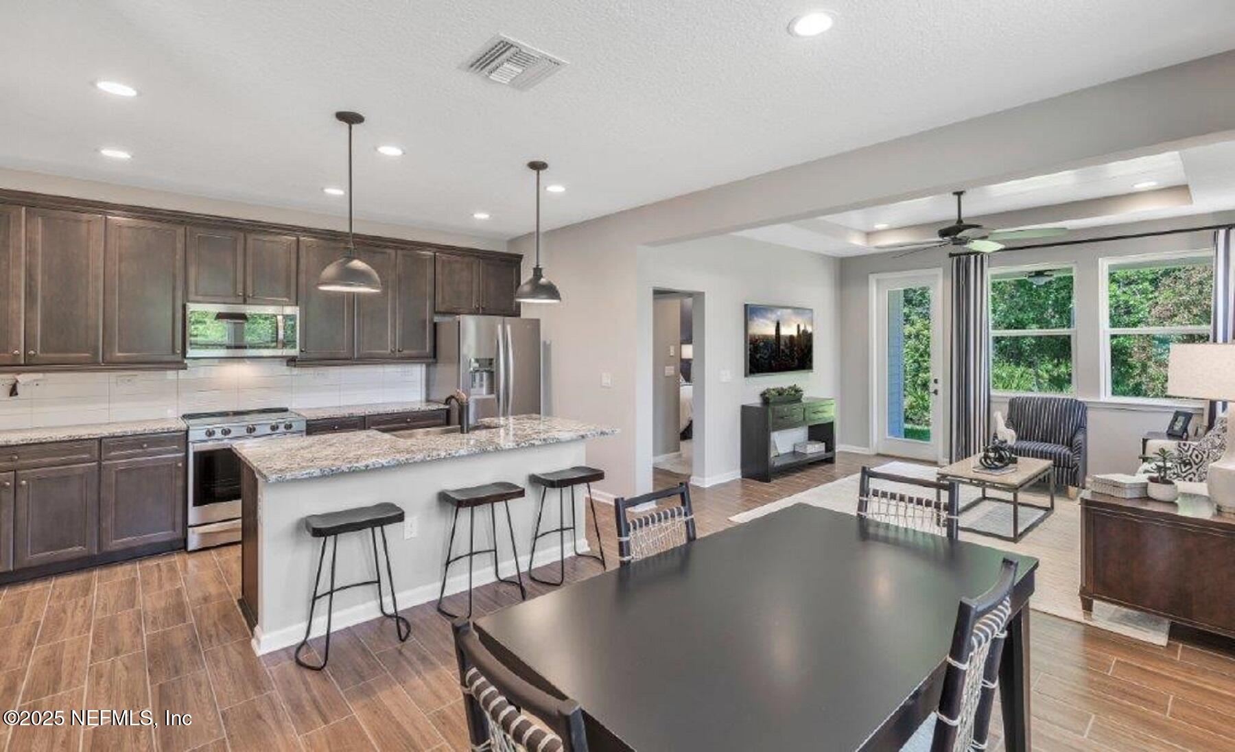 1000 Brk Frst Drive St. Augustine, FL 32092 - Photo 3 of 14 a large kitchen with a table and chairs