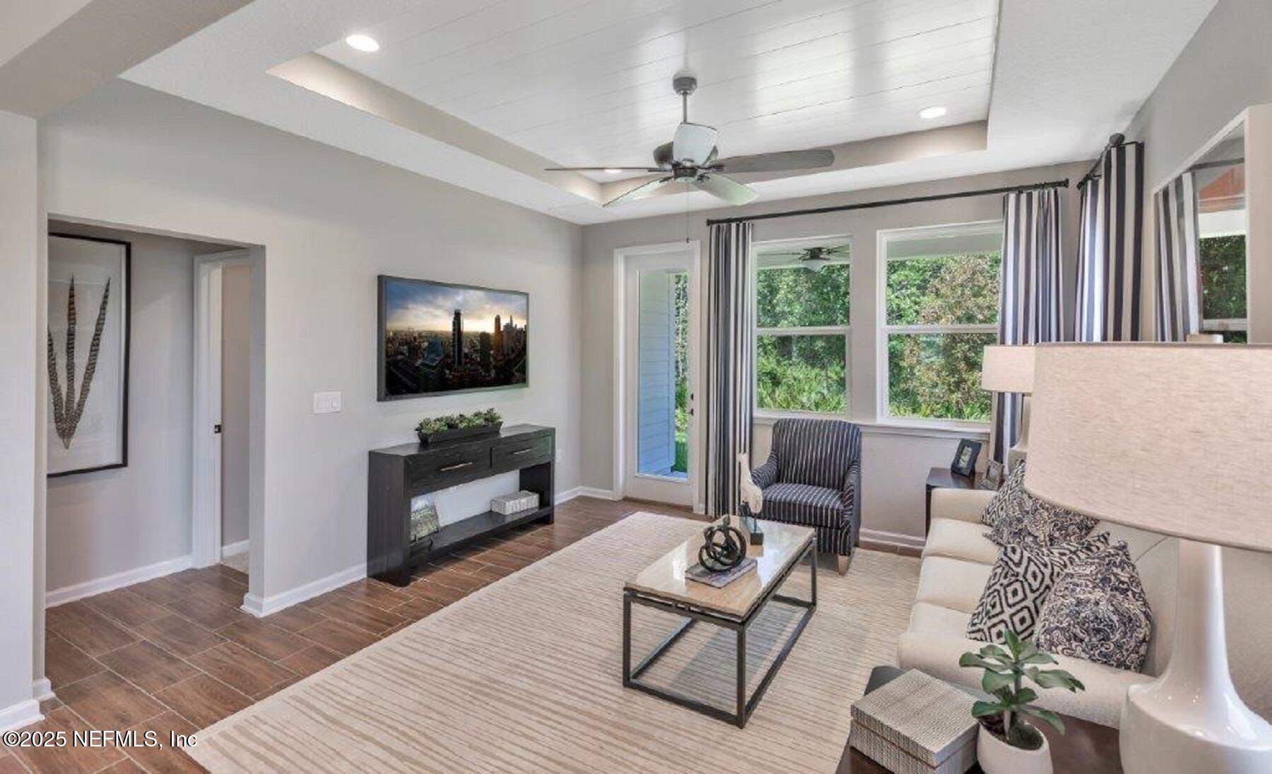 1000 Brk Frst Drive St. Augustine, FL 32092 - Photo 8 of 14 a living room with furniture and a flat screen tv