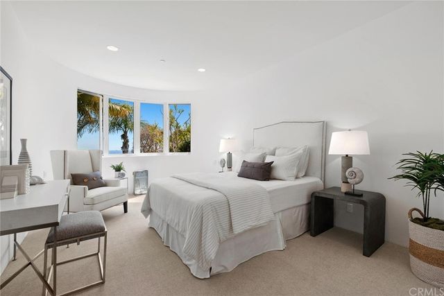 a front view of a house with a yard and a garage