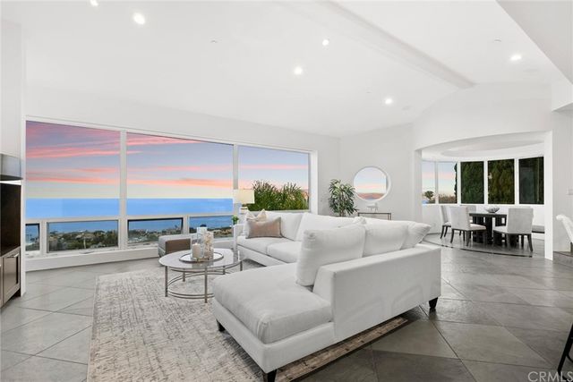 a large kitchen with kitchen island granite countertop lots of counter top space and stainless steel appliances