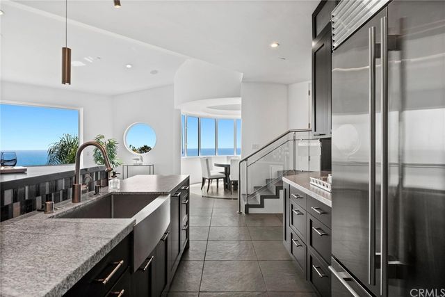 a view of a dining room with furniture and a potted plant