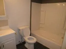 a bathroom with a sink toilet and bathtub