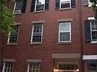 a couple of table and chair in front of building