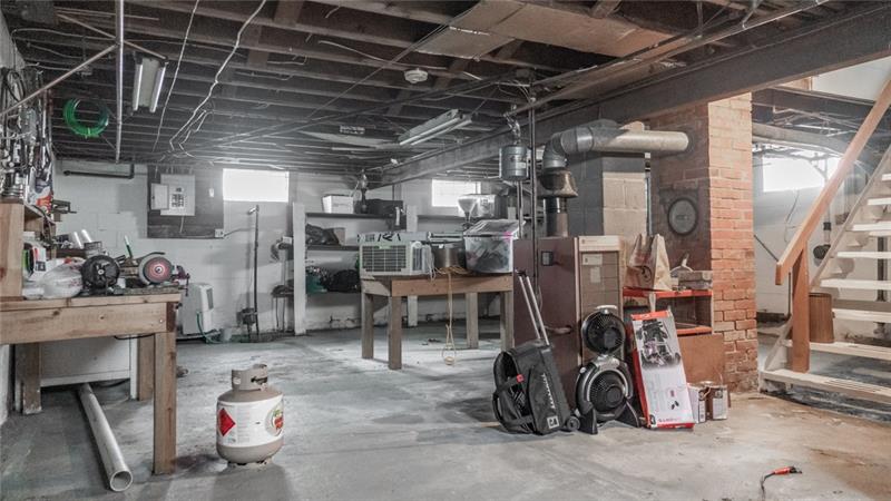 49 George Jr Road Grove City, PA 16127 - Photo 21 of 25 The basement is dry and includes a work shop area. It is accessed from inside the house, and has walk up steps to the backyard
