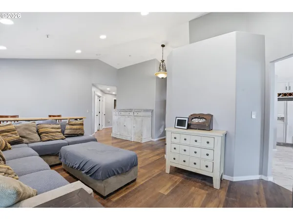 a spacious bedroom with a bed and cabinet