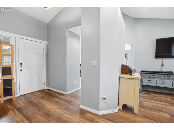 a workspace with kitchen island and wooden floor