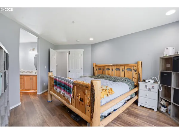 a bedroom with a bed and a closet