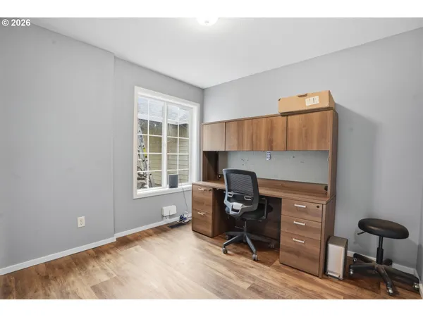 a workspace with furniture and a window