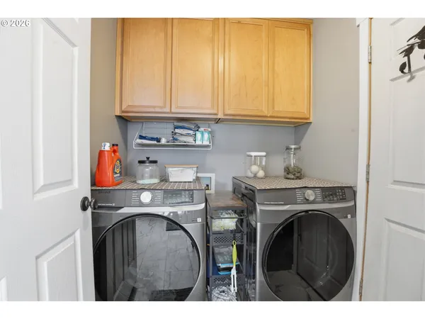 a utility room with dryer and washer