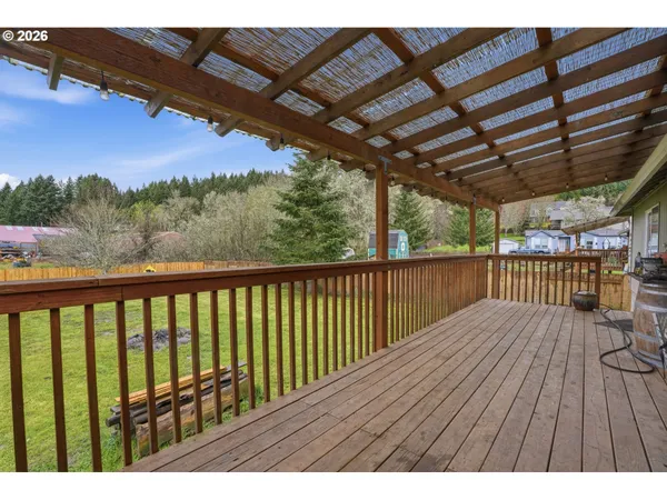 a view of balcony with wooden floor