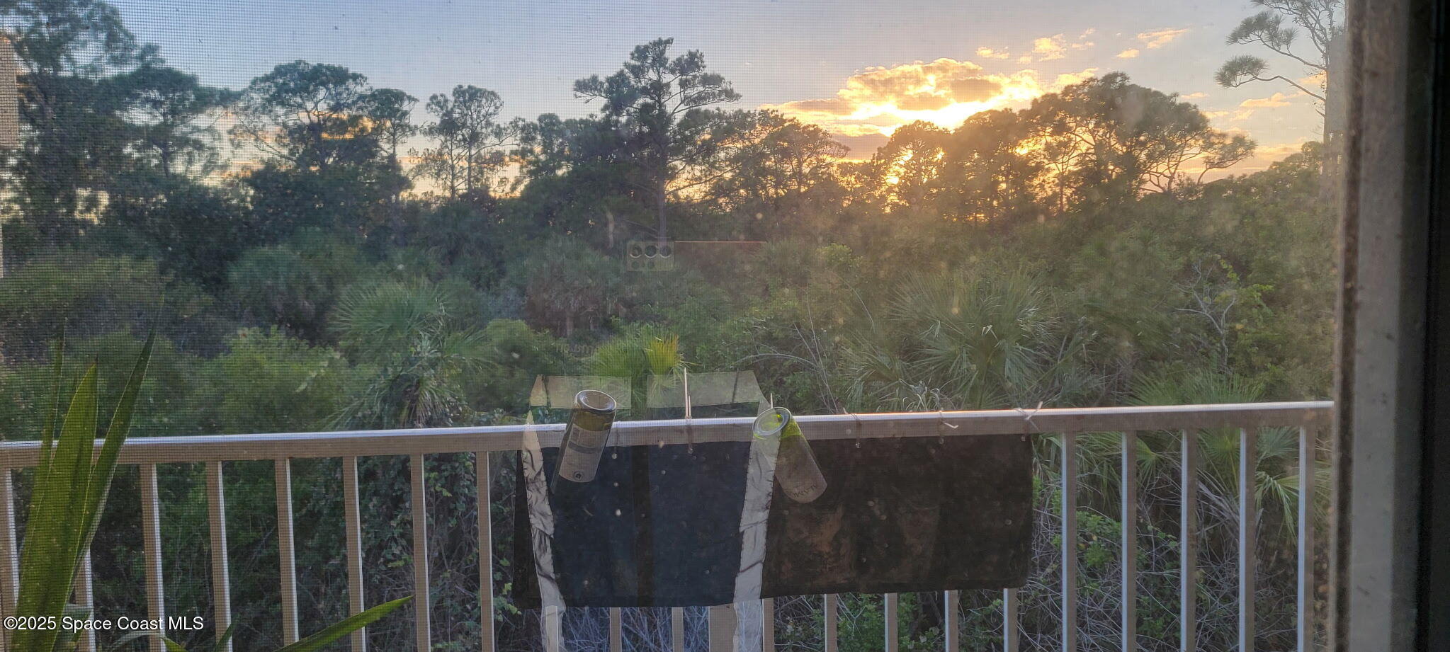 4067 Meander Place, Unit 204 Rockledge, FL 32955 - Photo 16 of 17 a view of a balcony with wooden fence