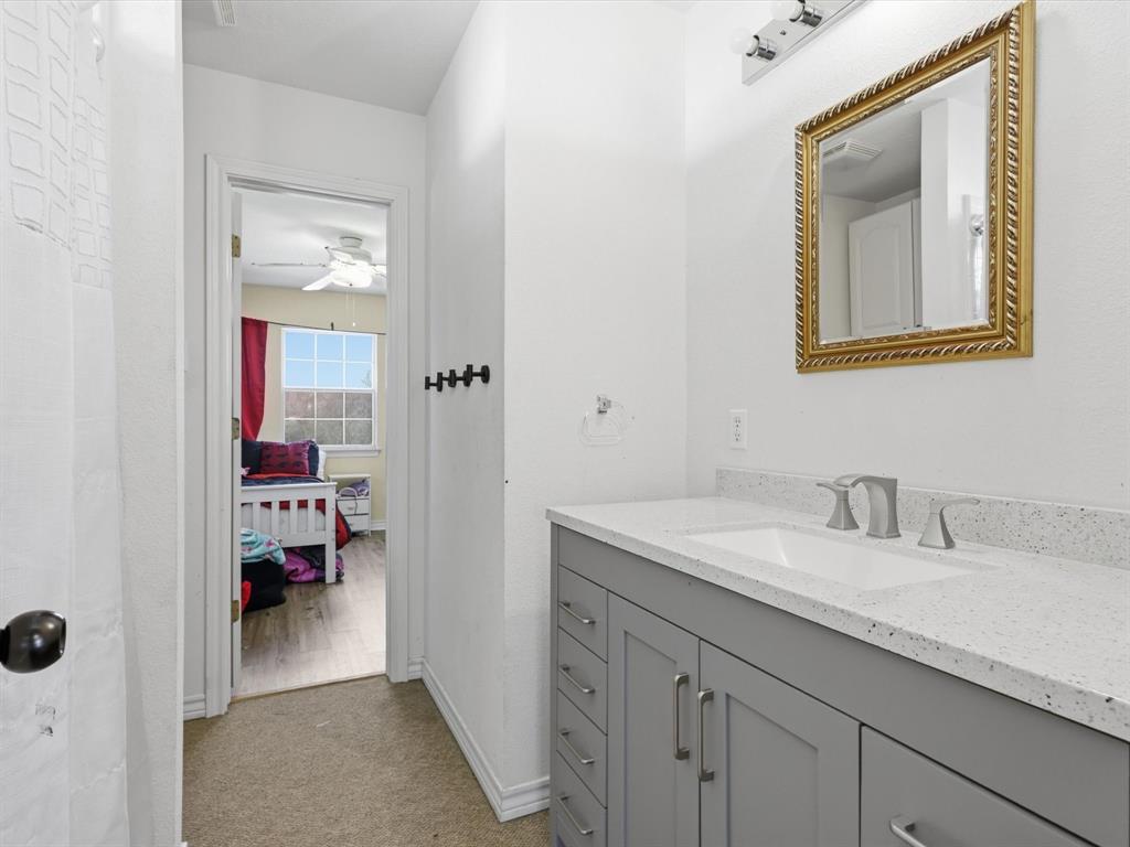 130 Parsonage Street Azle, TX 76020 - Photo 22 of 39 Bathroom featuring vanity and light carpet