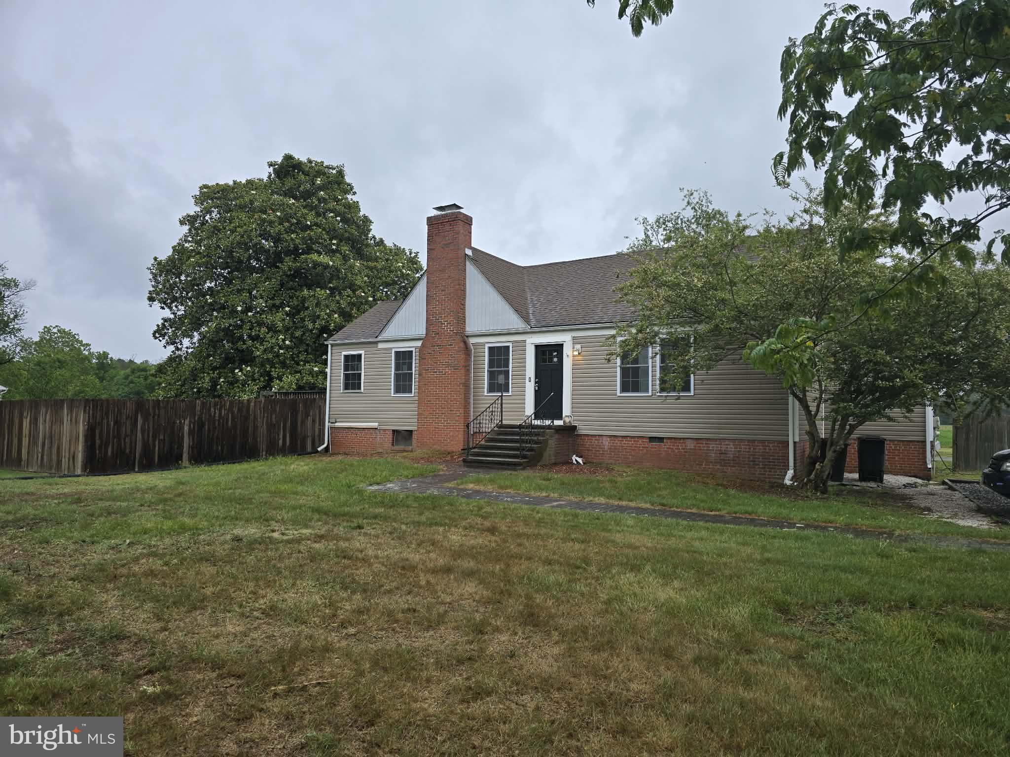 a house view with a garden space