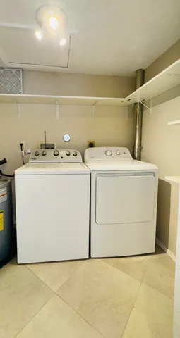 a view of residential houses with outdoor space and lakeside