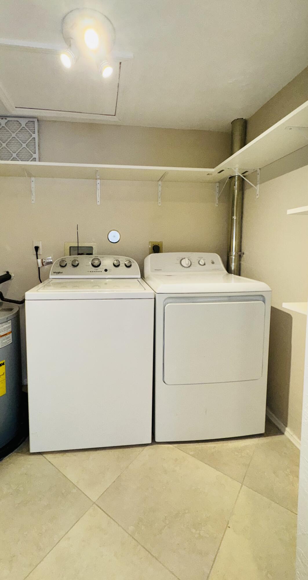 1708 Palm Beach Trace Drive Royal Palm Beach, FL 33411 - Photo 11 of 13 a utility room with dryer and washer
