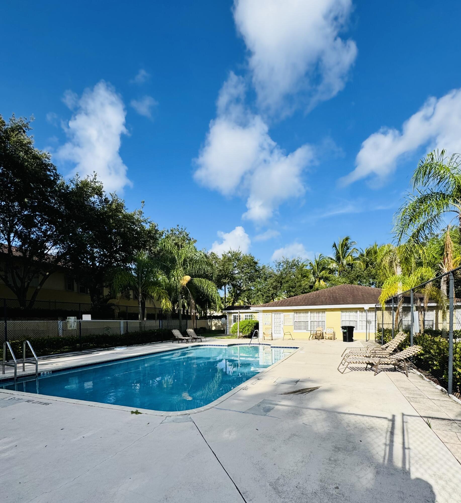 1708 Palm Beach Trace Drive Royal Palm Beach, FL 33411 - Photo 12 of 13 a view of residential houses with outdoor space and lakeside