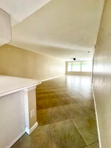 a kitchen that has a sink and a stove