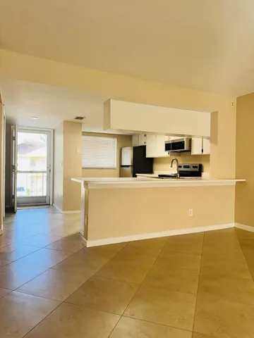 a view of an empty room with a window