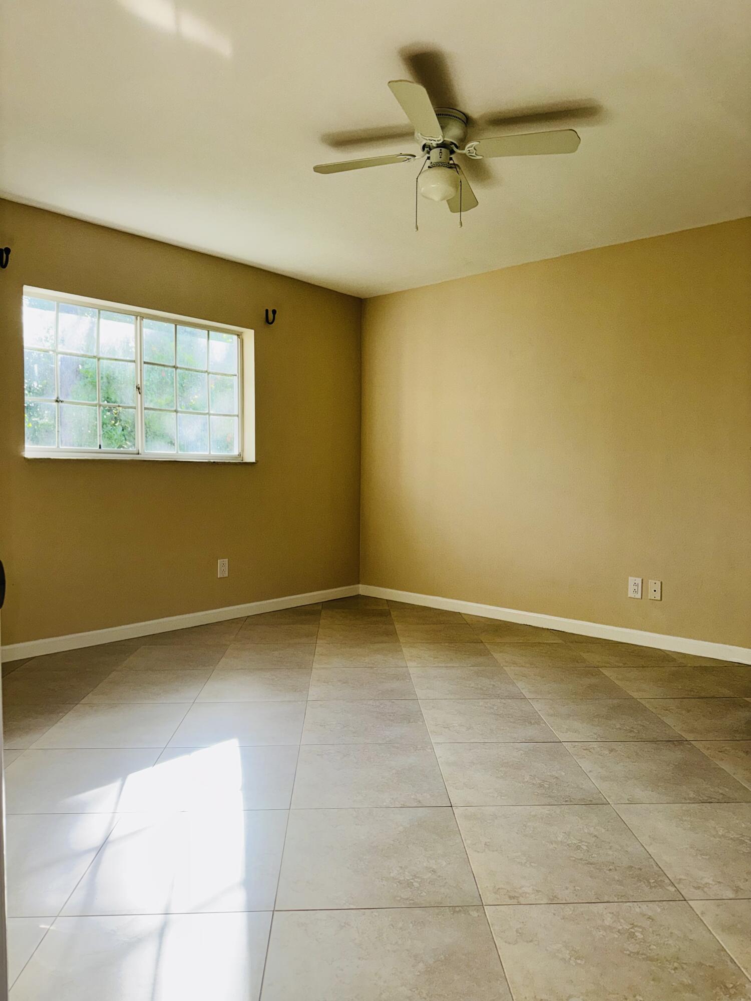 1708 Palm Beach Trace Drive Royal Palm Beach, FL 33411 - Photo 9 of 13 a view of an empty room