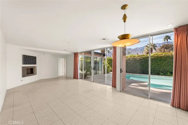 a view of an empty room and glass door