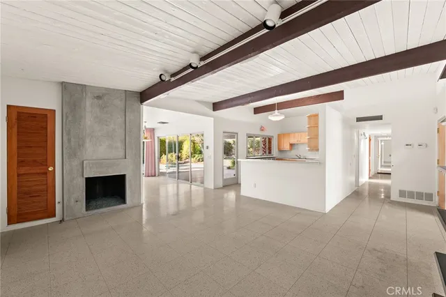 a kitchen with stainless steel appliances granite countertop a stove a sink dishwasher and a microwave oven with cabinets