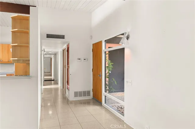 a kitchen with a sink appliances and cabinets