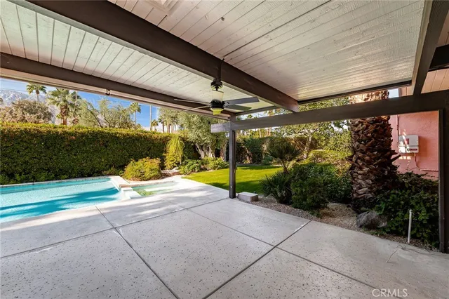 a view of a swimming pool with a patio
