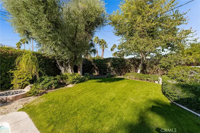 a backyard of a house with a swing