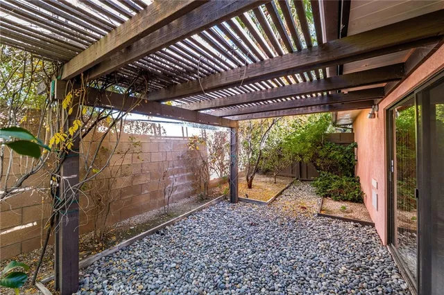 a view of a swimming pool with an outdoor space and seating area
