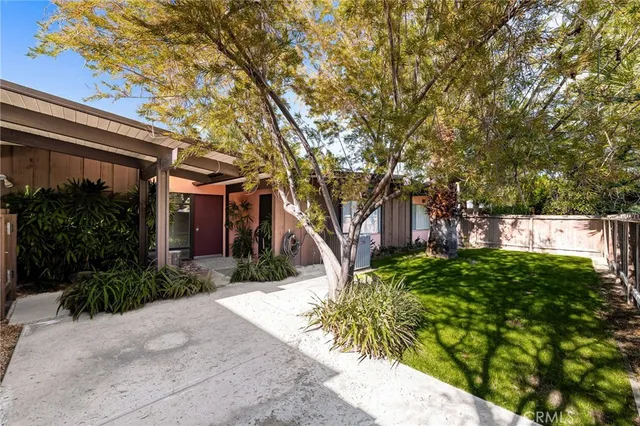 a backyard of a house with lots of green space