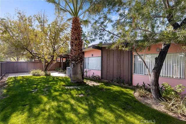 a couple of potted plants in front of door