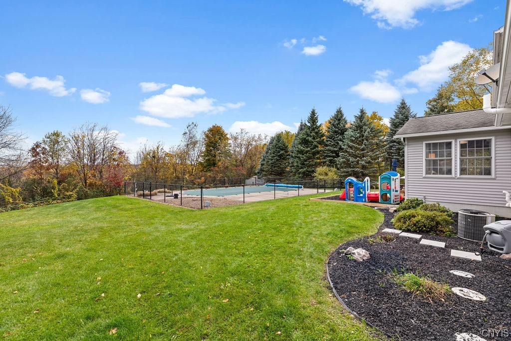 138 Eagle Crest Drive Camillus, NY 13031 - Photo 3 of 50 Expansive 1 acre lot with a lush tree-studded yard