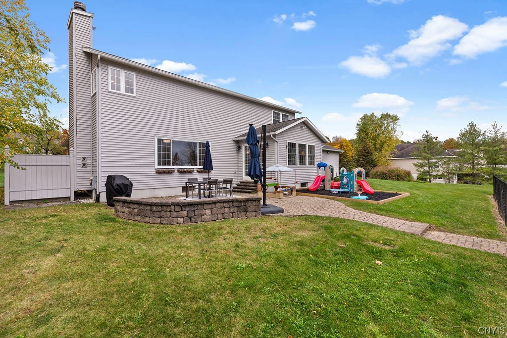 138 Eagle Crest Drive Camillus, NY 13031 - Photo 5 of 50 Sliders open to the brick patio and a dedicated ch