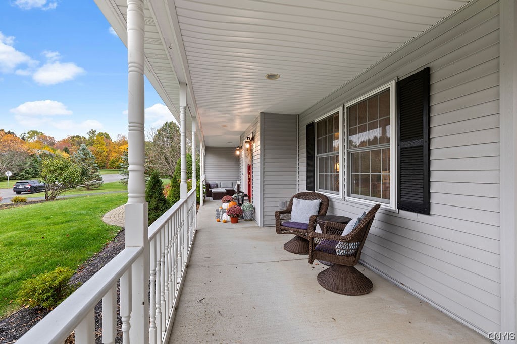 138 Eagle Crest Drive Camillus, NY 13031 - Photo 8 of 50 This wrap-around porch enhances the overall appeal