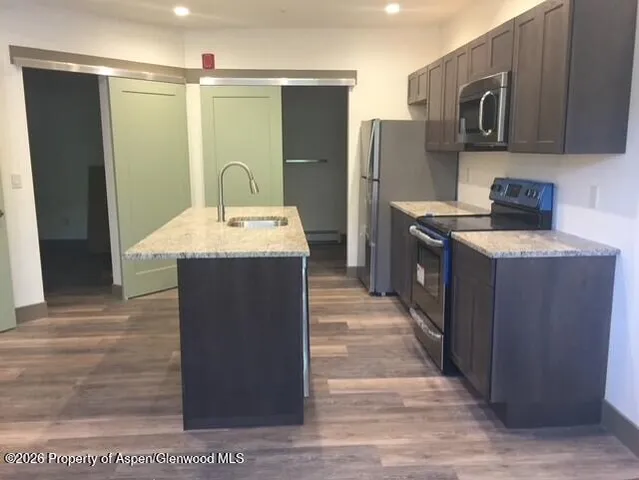 a white toilet sitting next to a bath tub