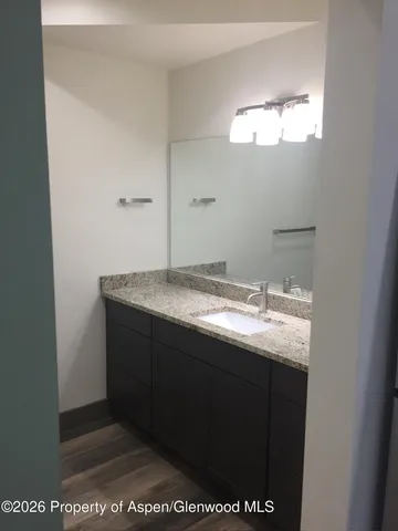 a kitchen with a refrigerator and a stove