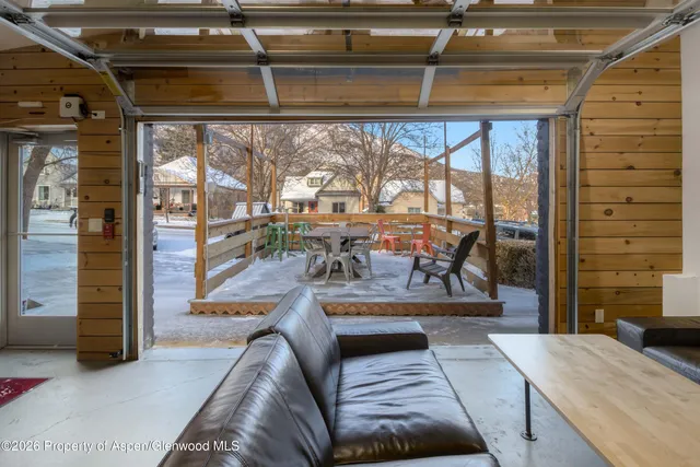 a view of a living room and balcony