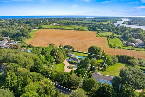 an aerial view of houses with yard