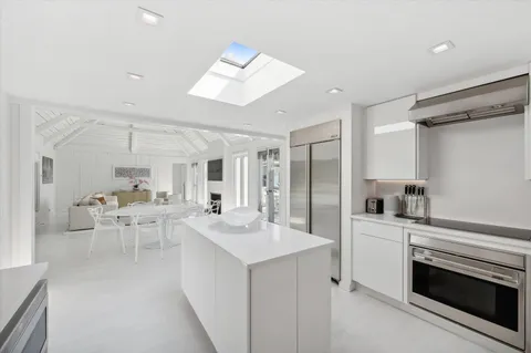 a large bedroom with a bed and a fireplace